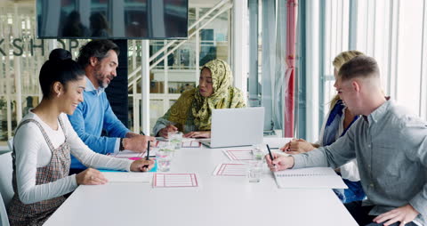 Diverse Team Engaging in Office Meeting Collaboration