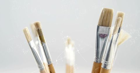 Showcasing wooden handle paintbrushes with soft bristles for minimalist art studio
