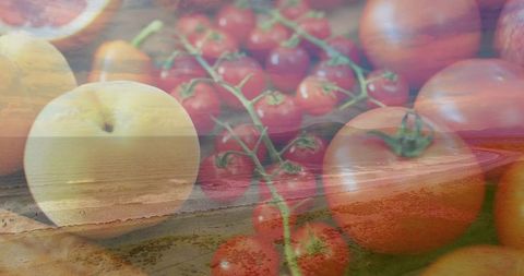 Double exposure coastal sunset blending fresh tomatoes, cherry vine, peach and bread