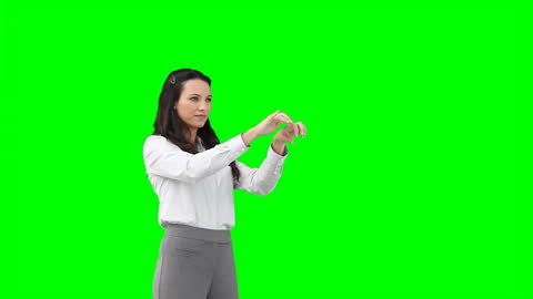 Business Woman Using Virtual Interface in Front of Green Screen