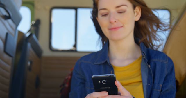 Woman Using Smartphone in Van Interior - Download Free Stock Images Pikwizard.com