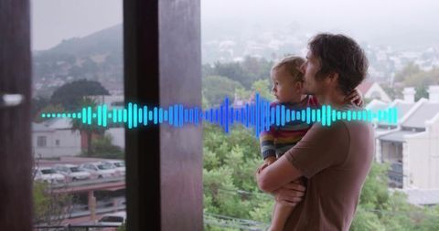 Father holding toddler on balcony with voice waveform overlay conveying bonding