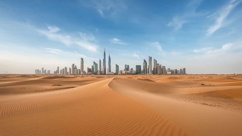 Standing Skyline Emerging from Desert Sands with Iconic Skyscraper