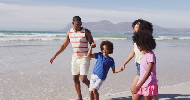 Happy Family Walking on Beach Shore Enjoying Sunny Day - Download Free Stock Images Pikwizard.com