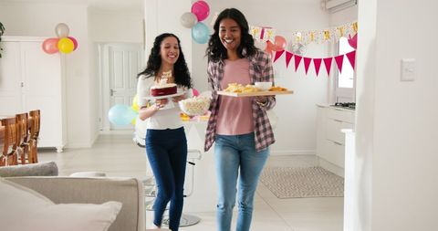 Happy Family Preparing Snacks for Festive Celebration at Home