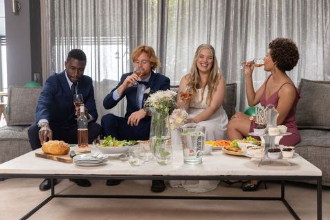 Elegant Wedding Party Toasting with Wine in Stylish Setting