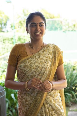 Smiling indian woman in traditional saree outdoors