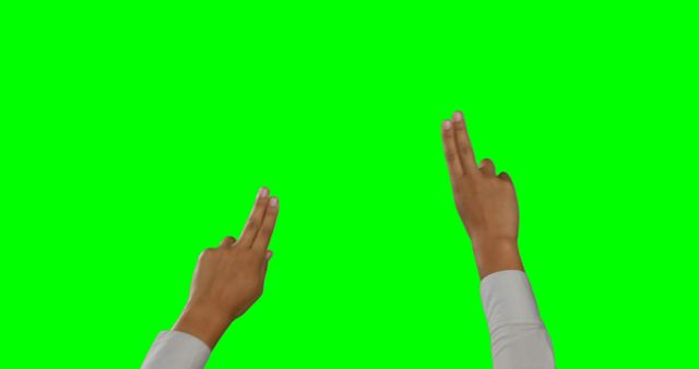This image shows a close-up of two hands making the peace sign against a green screen background. This can be used in presentations, educational materials, digital graphics, web design, or promotional content needing a peace or victory symbol. The green screen makes it easy to change the background or integrate into various digital settings.