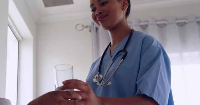 Attentive Nurse Providing Water to Patient in Hospital Room - Download Free Stock Images Pikwizard.com