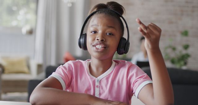 Happy African American Girl Enjoying Music with Headphones at Home - Download Free Stock Images Pikwizard.com