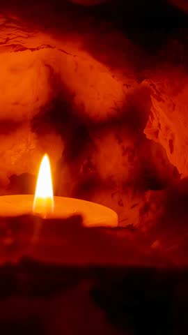 Flickering Candle Flame Dancing Inside Red Rock Alcove Vertical Ambient Footage