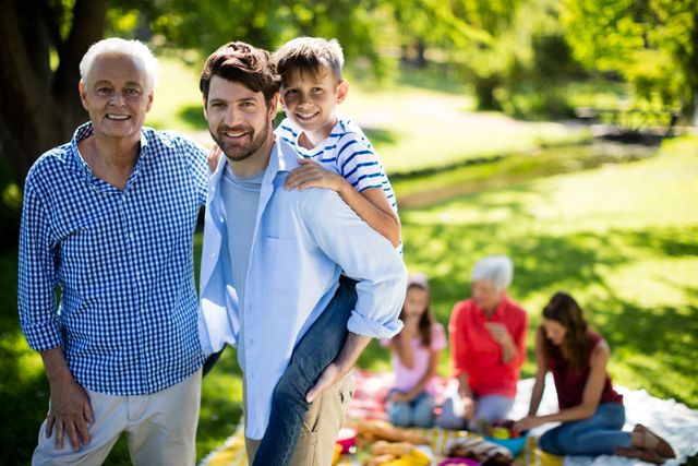 Portrait of happy family enjoying in park on sunny a day