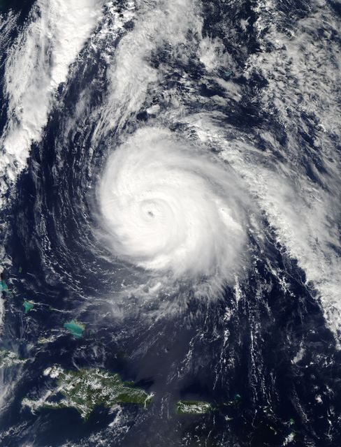 This striking image of Hurricane Gonzalo in the Atlantic Ocean is captured by NASA's Terra satellite on October 16. Taken from space, it showcases the large bands of thunderstorms as they wrap tightly around the eye of the hurricane, a Category 4 storm. Such images can be used for public awareness about natural disasters, meteorology studies, presentation materials in environmental science, and supplementary content for weather-related forecast announcements or reports. This image can also help reinforce the importance of disaster preparedness.