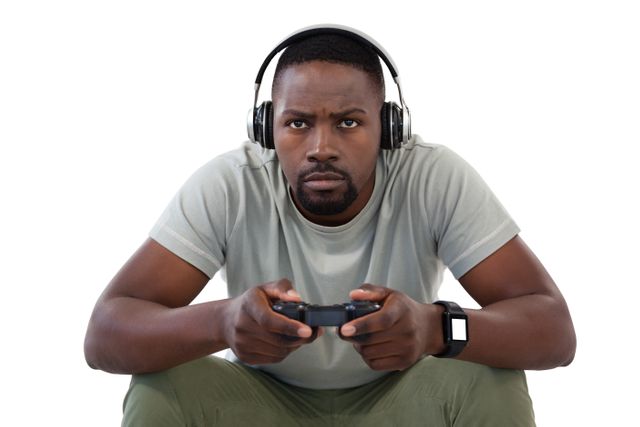 Concentrate man playing video games against white background