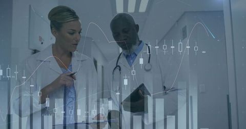 Clinicians consulting while reviewing tablet with data overlays and healthcare charts