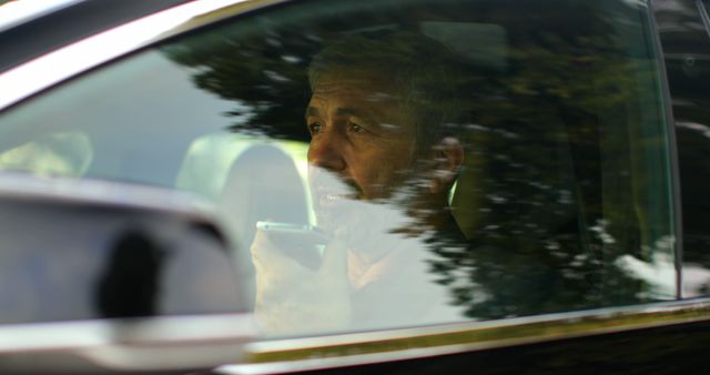 Mature Man Driving Car while Using Two-Way Radio - Download Free Stock Images Pikwizard.com