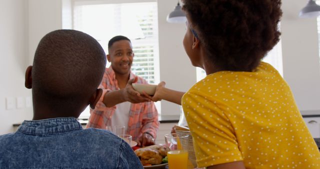 Family Sharing Meal Together in Bright Kitchen - Download Free Stock Images Pikwizard.com