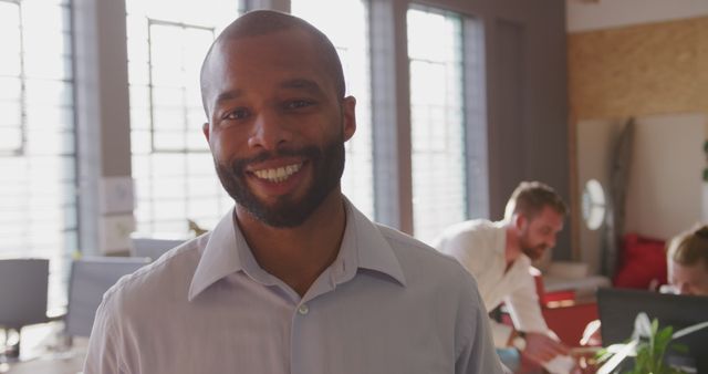 Confident Male Professional Smiling in Modern Office - Download Free Stock Images Pikwizard.com