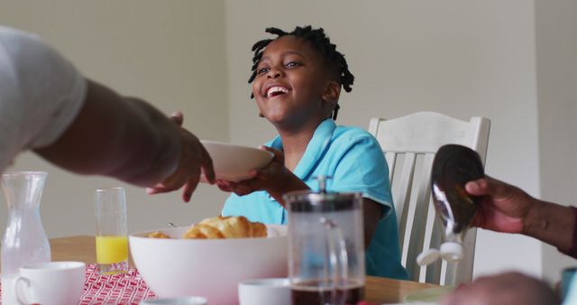 Joyful Family Breakfast with Smiling Girl Passing Bowl - Download Free Stock Images Pikwizard.com