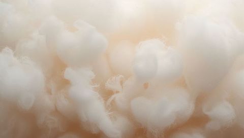Soft Cottonlike Fiber Tufts Macro Texture Warm Beige Plush Cloudlike Close-up Background
