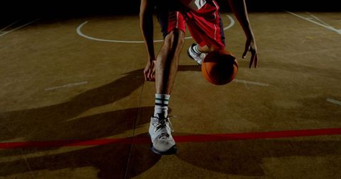 Basketball Player Dribbling Under Dramatic Lighting - Download Free Stock Images Pikwizard.com