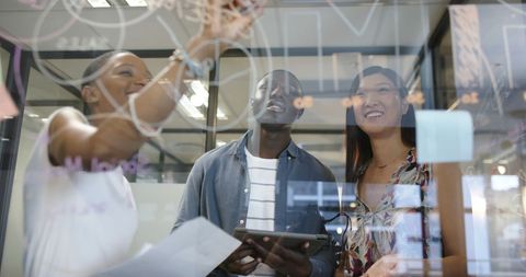 Diverse Team Collaborating with Transparent Board in Office - Download Free Stock Images Pikwizard.com