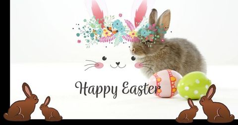 Brown baby rabbit sitting beside pastel easter eggs with floral bunny face and happy easter greeting