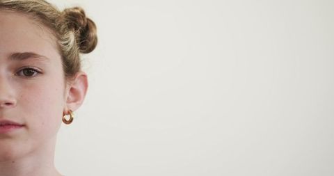 Preteen Girl with Hoop Earring and Minimalist Aesthetic