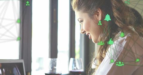 Smiling Woman Typing on Laptop with Network Icons