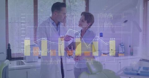 Dental Professionals Analyzing Patient Data on Tablet with Digital Charts and Analytics