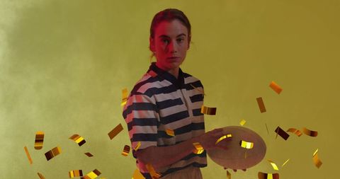 Confetti Falling Over Focused Female Rugby Player