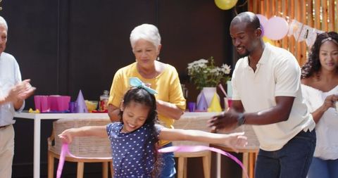 Joyful Birthday Celebration with Granddaughter Hula Hooping