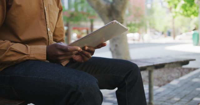 Man Holding Tablet in Urban Outdoor Setting - Download Free Stock Images Pikwizard.com