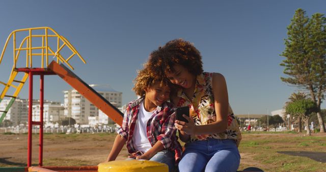 Mother and Daughter Enjoying Time at Playground on Bright Sunny Day - Download Free Stock Images Pikwizard.com