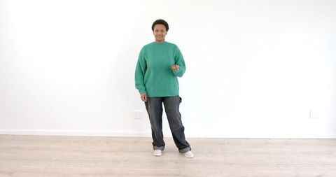 Woman in Green Sweater Pondering in Minimalist Interior - Download Free Stock Images Pikwizard.com