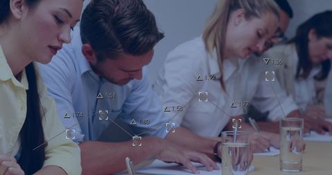 Focused Professionals Analyzing Data in Formal Setting - Download Free Stock Images Pikwizard.com