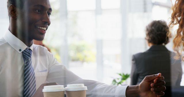 Businessman Greeting Colleague in Cafe Meeting - Download Free Stock Images Pikwizard.com