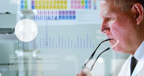 Scientist analyzing data with high-tech graphics overlay in laboratory