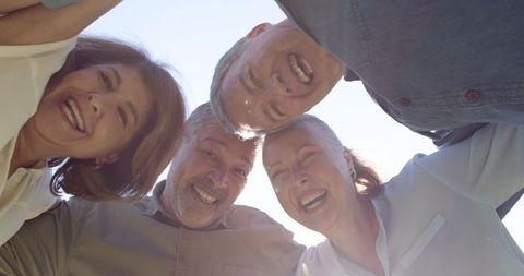 Diverse Friends Smiling Radiantly Under Open Sky