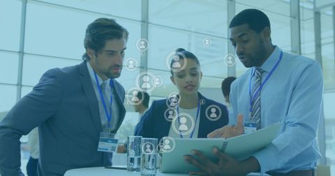 Diverse Business Team Analyzing Data in Office with Global Icons Overlay - Download Free Stock Images Pikwizard.com