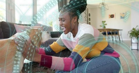 Woman interacting with dog indoors for happy lifestyle moment