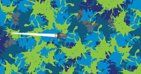 Paintbrush creating colorful abstract art on vivid background