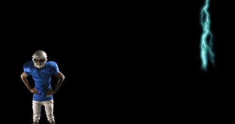 Confident Football Player Against Dramatic Lightning Background