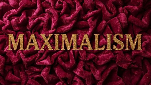 Gold maximalism letters on luxurious red velvet folds with glittering metallic typography