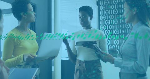 Diverse colleagues engaged in office discussion on financial data