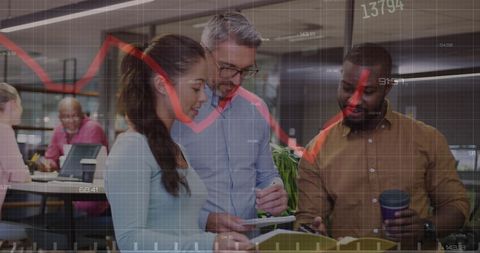 Diverse executives reviewing financial data in modern office