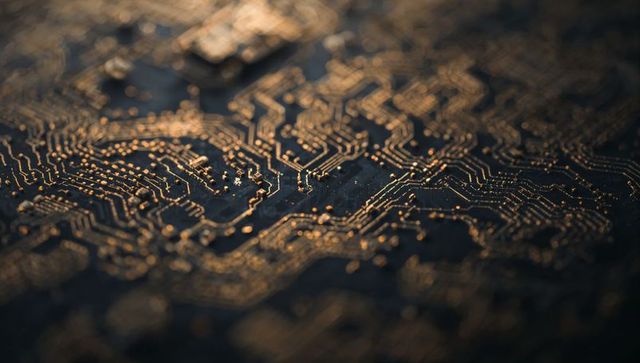 Golden pcb traces glinting in macro low light close-up electronic circuit background