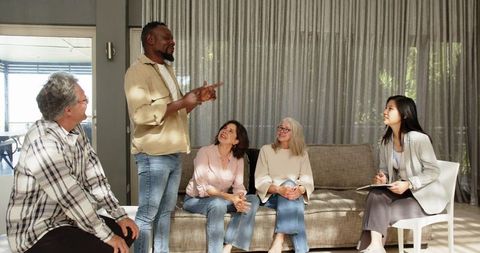 Therapist engaging with group in collaborative session