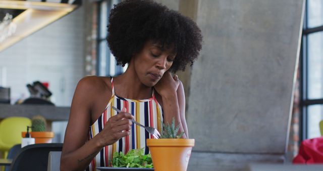 African-American Woman Eating Healthy Salad at Modern Cafe - Download Free Stock Images Pikwizard.com