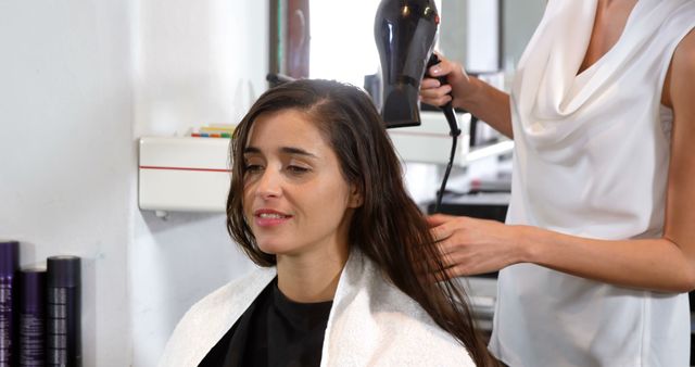 Woman Receiving Hair Styling In Salon - Download Free Stock Images Pikwizard.com